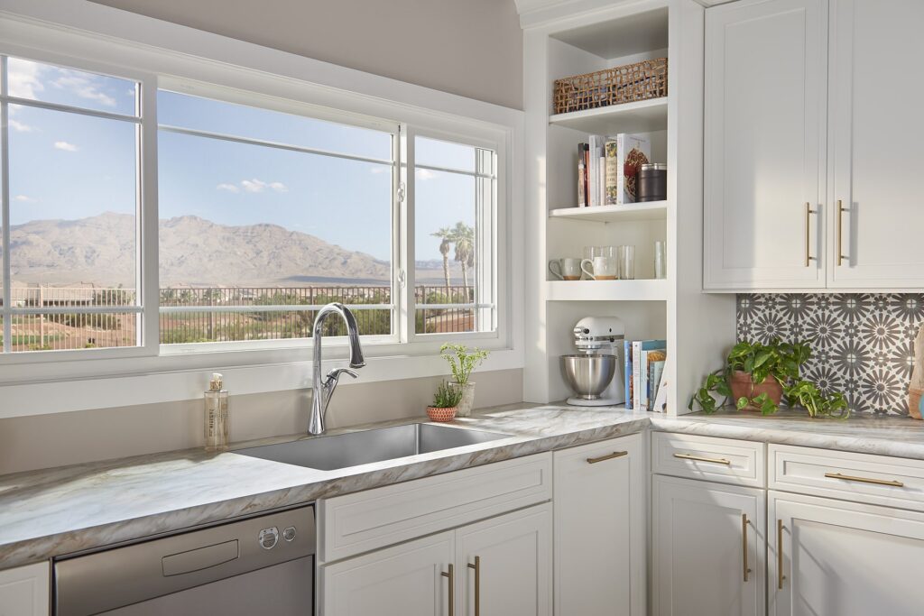 Kitchen with an awning window and mountain view.